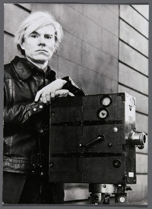 Andy Warhol, Self Portrait (Andy Warhol with film camera taken during the heyday of his Factory films), 1977 Courtesy of the Agns b. Collection